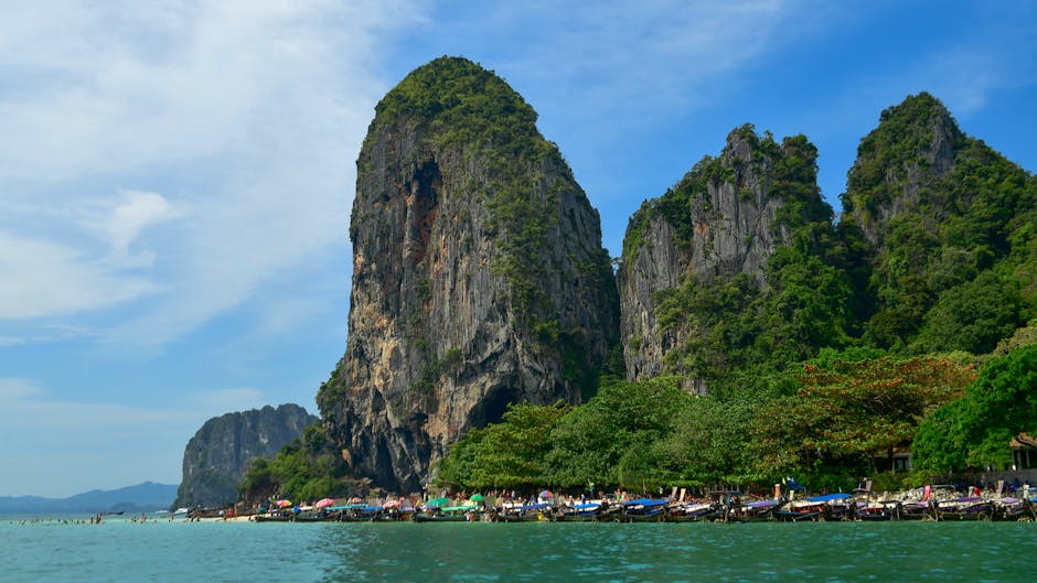 Explore the breathtaking limestone cliffs and turquoise waters of Krabi Beach, Thailand. Perfect for travel and adventure